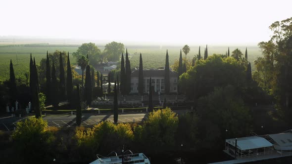 Low orbit aerial of Grand Island Mansion wedding venue near Sacramento alt
