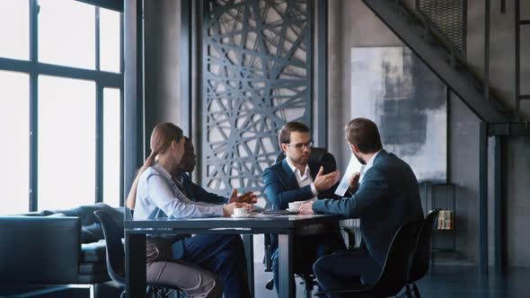 Successful business professional presenting analytical report while working alt