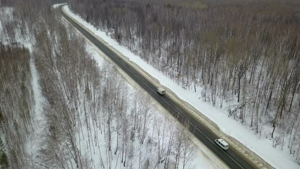 Truck And Van On Winter Country Road