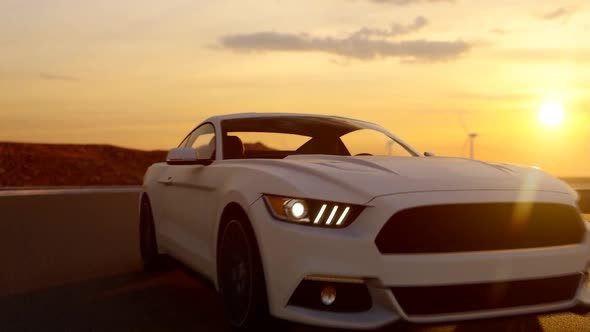 White Sports Car Tracking While Driving On Asphalt Road At Sunset