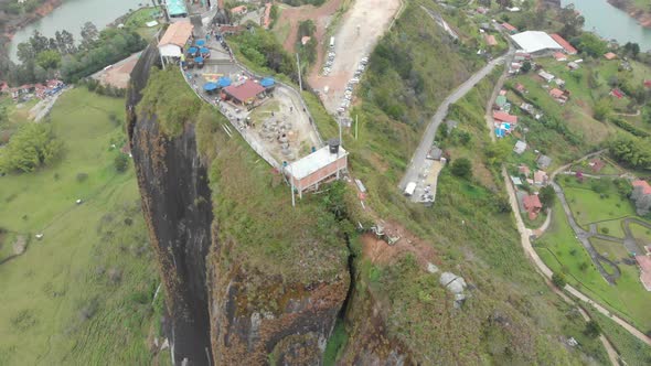 Aerial Of El Peñol Big Rock In Colombia - drone shot alt