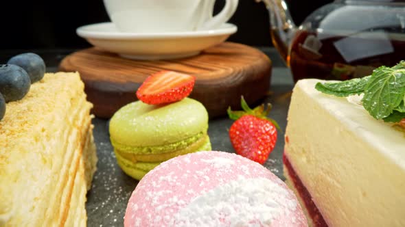 Variety of Cakes with Fruits. Cheese Cake, Chocolate Cake and Cream Puff Cake. Strawberry and Mint alt