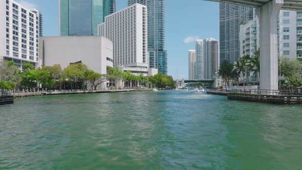 Forwards Tracking of Motorboat Group Passing Under Bridge in Modern City alt