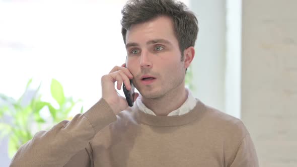 Portrait of Man Talking on Smartphone alt