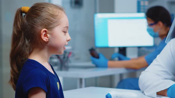 Close Up of Girl Portrait Talking with Doctor alt