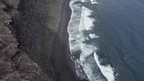 Ocean Waves Crashing At The Black Volcanic Sand Of Playa Nogales In La Palma, Spain.  aerial, forwar alt