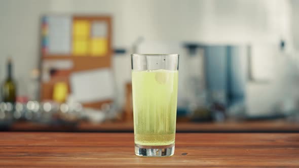 Effervescent Tablets Vitamin C Nutritional Supplements in Glass with Yellow Carbonated Water Sport alt