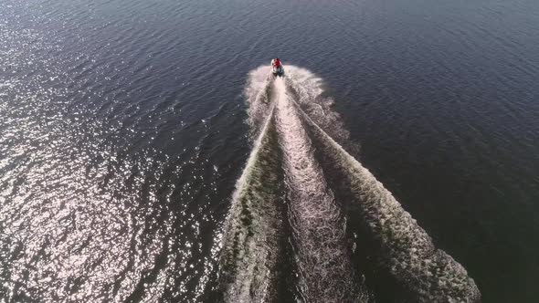 Aerial view of people ride on jetski on the city pond 26 alt