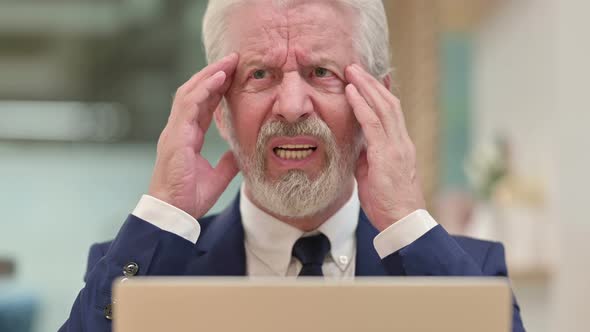 Close Up of Senior Old Businessman with Laptop Having Headache alt