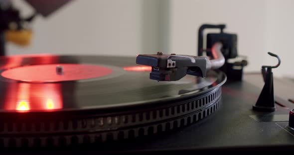 Hand Turns on a Vintage Vinyl Record and Vinyl Record is Spinning alt