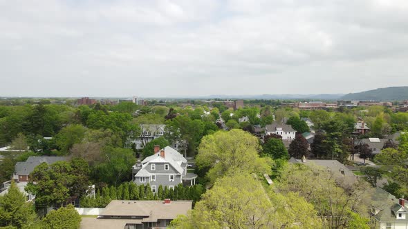 View over residential neighborhood in midwest city with mix of old and new architecture.