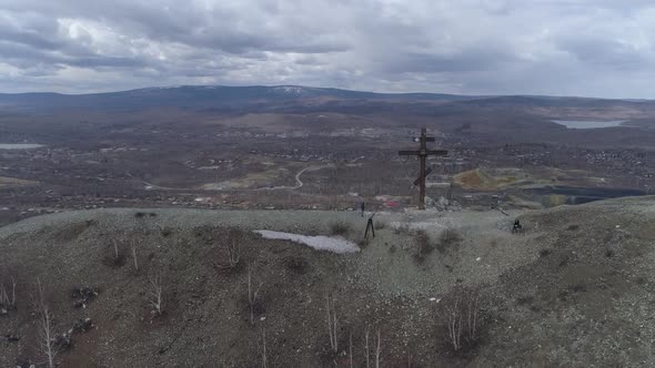 Orthodox cross on Mount Karabash and city view. The camera rises 05 alt