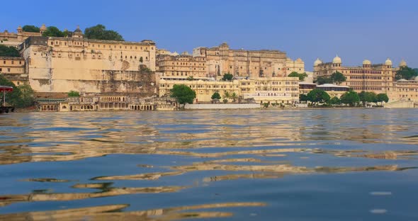 Udaipur City Palace on Lake Pichola with Tourist Boat - Rajput Architecture of Mewar Dynasty Rulers alt