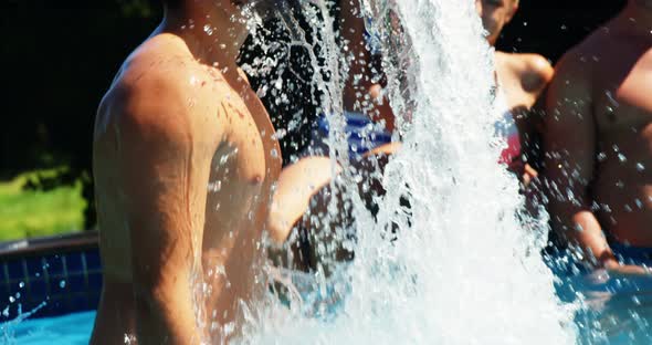 Man flipping his hair in swimming pool alt