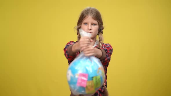 Rack Focus From Serious Teenage Girl to Earth Globe in Plastic Bag alt