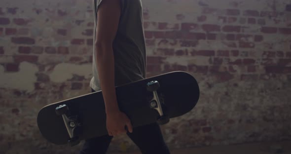 Fashionable young man in an abandoned warehouse alt
