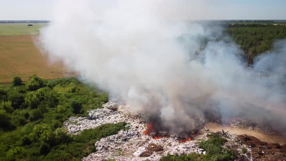 Flying around garbage dump site in fire