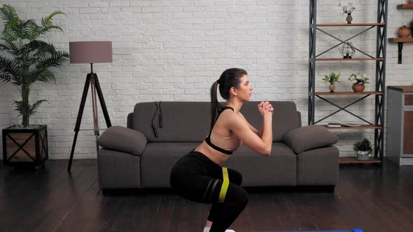 Fit Woman in Sportswear Does Sports Training Workout on Fitness Yoga Mat at Home alt