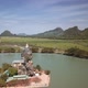 Aerial shot of the Kyauk Ka Lat Pagoda throning on a limestone pinnacle in Hpa-An, Myanmar - VideoHive Item for Sale