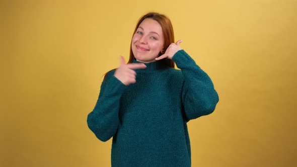Young Red Hair Woman Posing Isolated on Yellow Color Background Studio alt