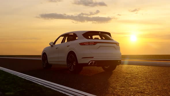White Sports SUV and Sunset