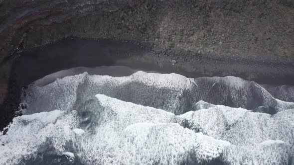 Foamy Waves Splashing In The Sea - Los Nogales Beach La Palma, Spain - aerial top down alt