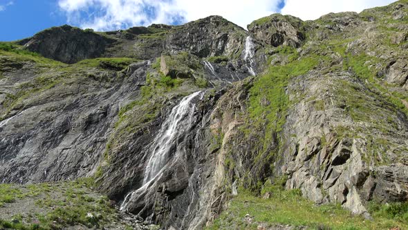View of waterfall scenes in mountains, national park Dombay, Caucasus, Russia