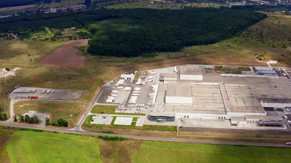 An agricultural plant in the middle of boundless agricultural land. alt