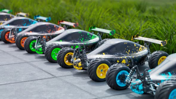 Multiple colourful remote-controlled buggy cars on a sidewalk in endless row. alt