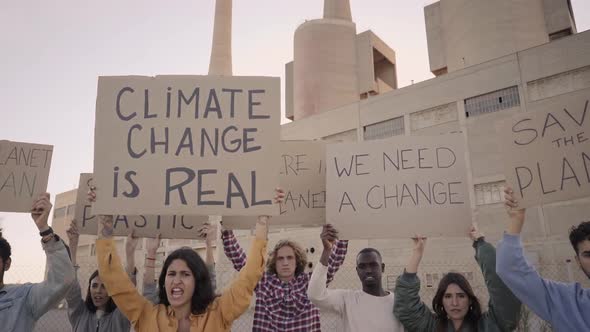 Slow Motion of People with Banners Protest As Part of a Climate Change March alt