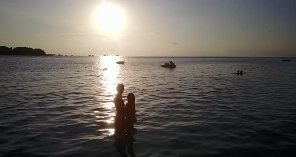 Fun people married on vacation enjoy life on beach on summer white sandy background  alt
