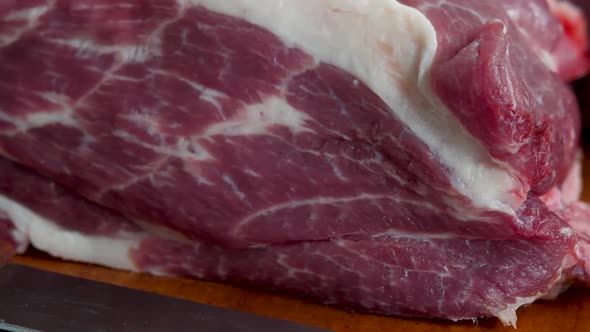 Fresh Raw Pork Meat with Fat on Chopping Board