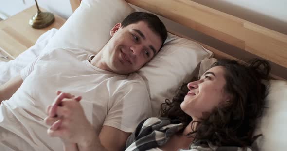 Happy Young Lovers Enjoy Time Spending Together at Home alt