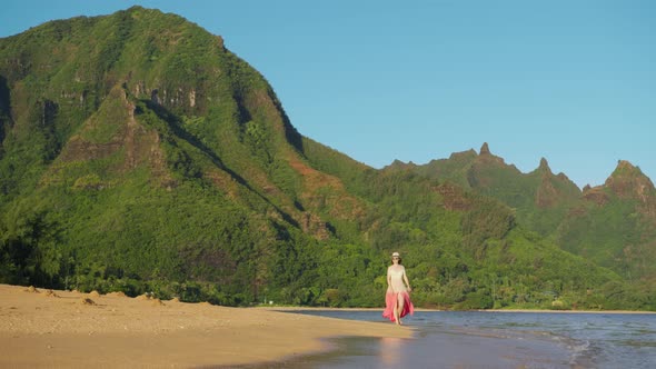 Young Tourist Girl at Hawaii Golden Beach at Tropical Green Mountain Landscape alt