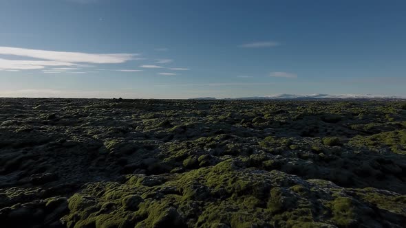Flying Over Rocks And Moss In Iceland alt