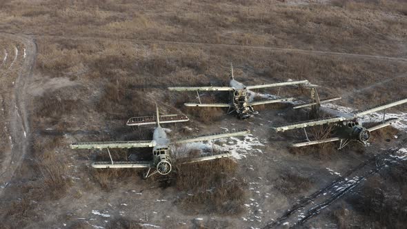 Three Broken Transport Planes  Light Transport Aircrafts Biplanes on the Airfield alt