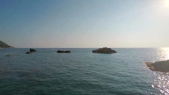 Aerial view of a very calm and relaxing beach in Greece. alt