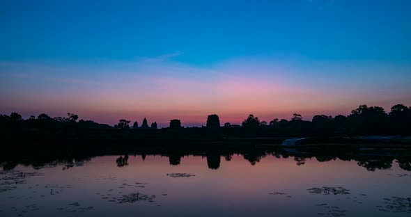 Sunrise time lapse at Angkor Wat main facade silhouette. World famous temple alt