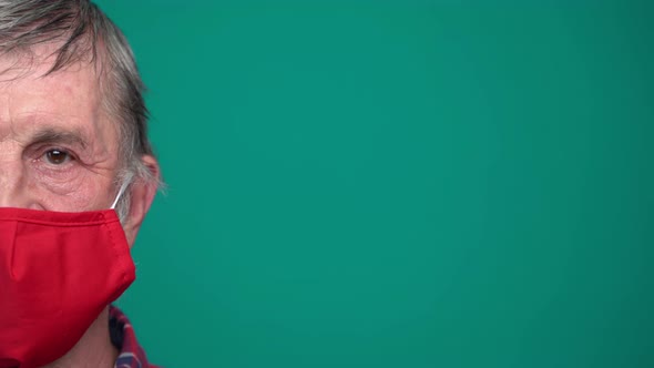 Portrait of Mature Man in Protective Red Medical Face Mask alt