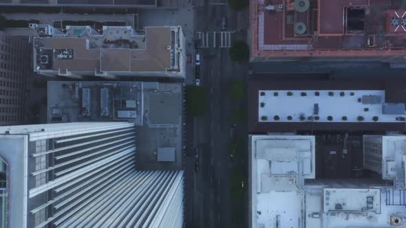 AERIAL: Slow Birds Eye View Flight Over Downtown Los Angeles California in Beautiful Sunrise Light alt