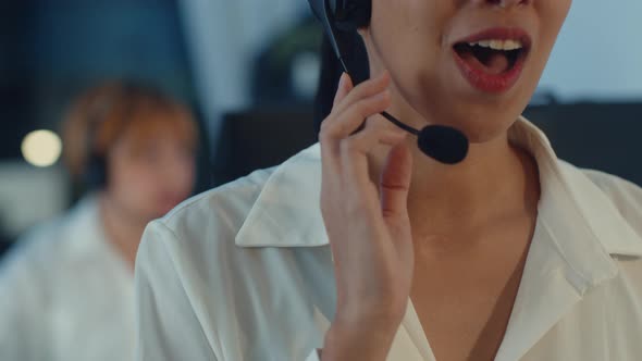 Asia young call center team or customer support service executive using computer and microphone. alt