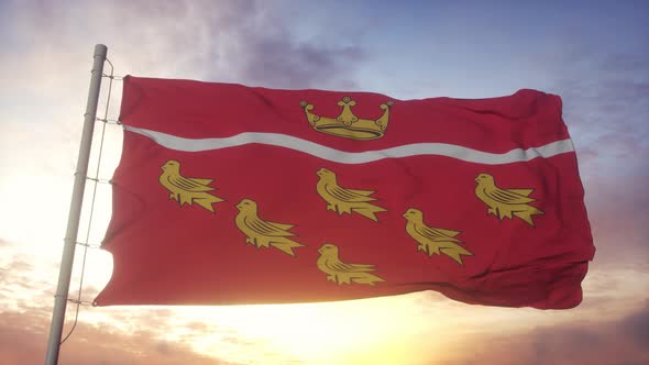 East Sussex Flag England Waving in the Wind Sky and Sun Background alt