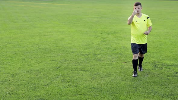 Soccer referee shows yellow card . Concept of sport, rules violation, offside. alt