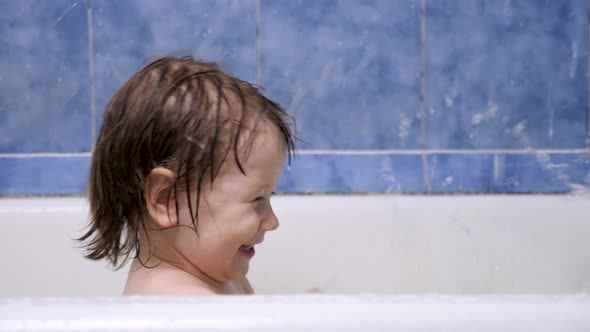 Attractive 2-3 Year Old Girl Takes a Bath. Wet Hair. Cute Blonde Child. Pretty Little Child Girl in