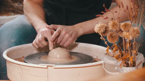 Pottery - the Master Is Moving His Index Finger on Wet Clay alt