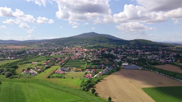 Aerial View of Village Near Mountains alt