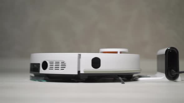Automatic Robot Vacuum Cleaner Cleaning the Room alt