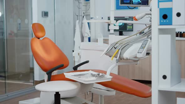 Revealing Shot of Stomatologist Chair with Nobody in alt