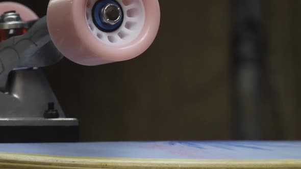 Smooth right to left trucking shot of a newly finished skateboard. alt