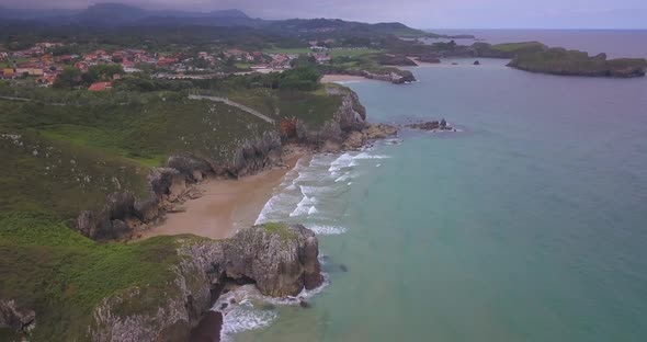 Rocky cliff shoreline of Asturias, north Spain. Off season, cloudy day alt